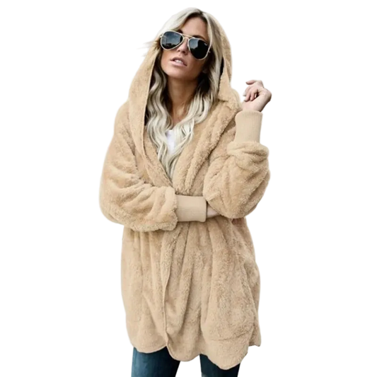 Woman wearing a beige fluffy hooded coat on a white background
