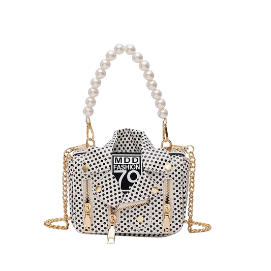 Polka dot handbag with gold chain and pearl handle on a white background