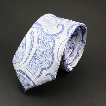 Blue and white paisley patterned tie on a black background