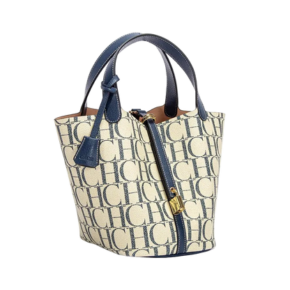 Handbag with monogram pattern and blue accents on a white background