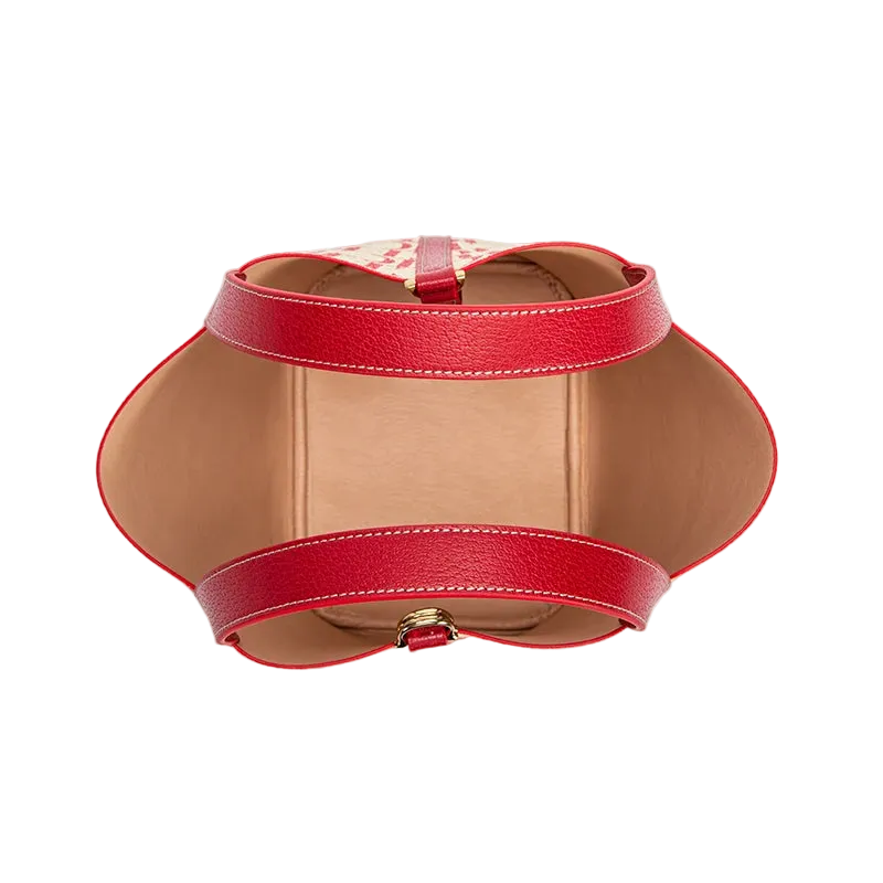 Red leather belt with a gold buckle on a white background