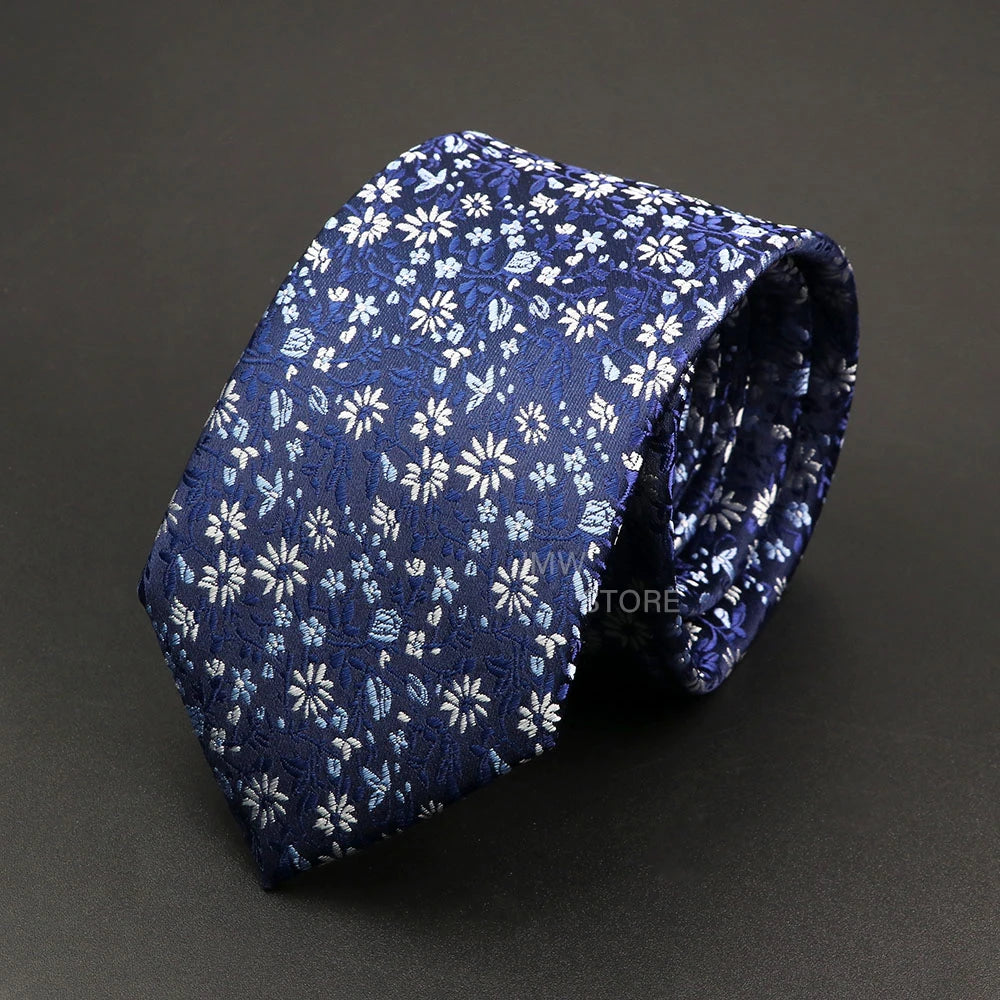 Blue floral patterned tie on a dark gray background