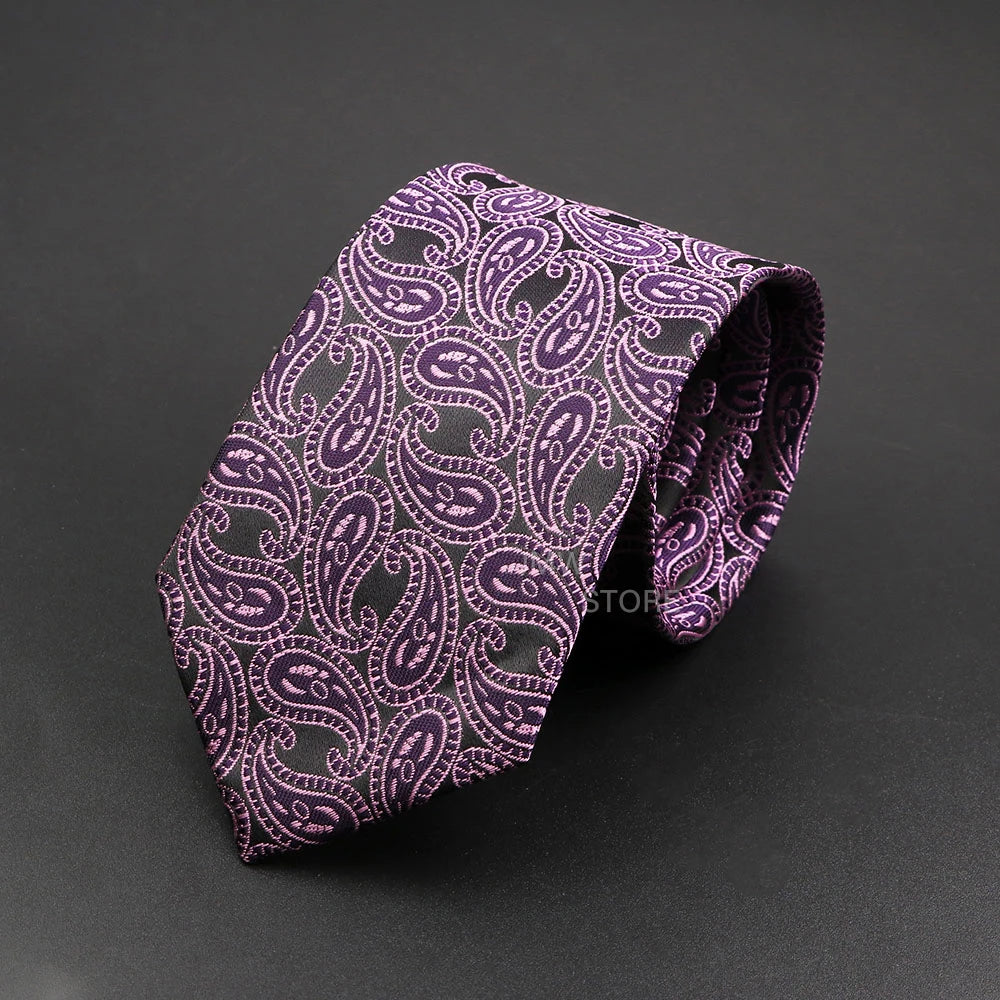 Purple paisley patterned tie on a dark gray background