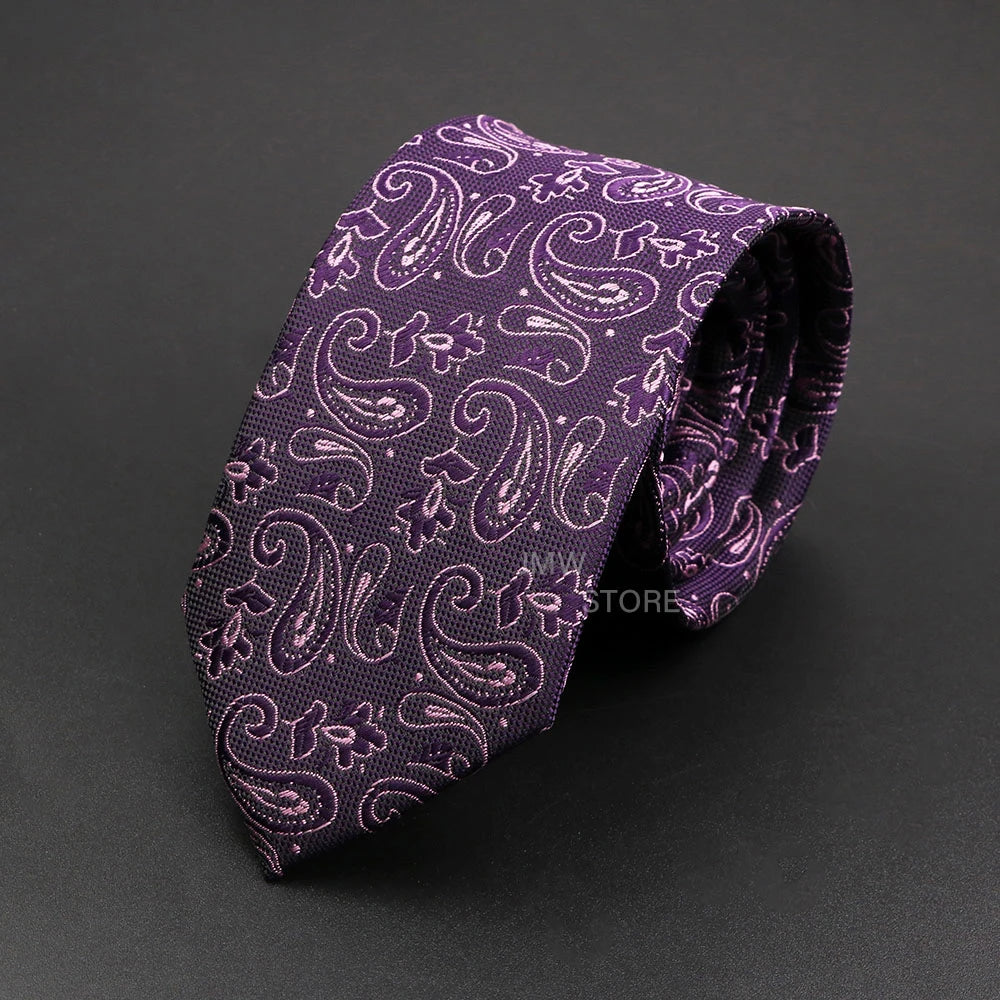 Purple paisley patterned tie on a dark gray background